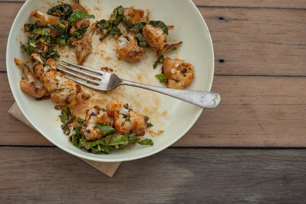 Cauliflower dish left unfinished with fork on plate